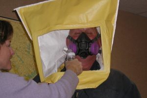 Employee using a respirator for protection